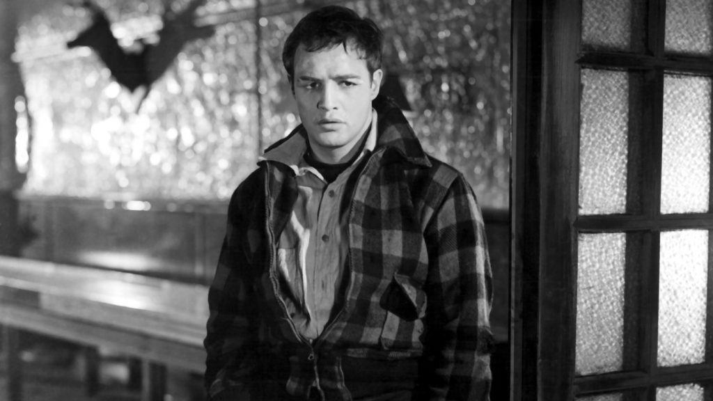 As dockworker Terry Malloy in Elia Kazan's On the Waterfront, a young Marlon Brando firmly established himself as a leading Hollywood icon.